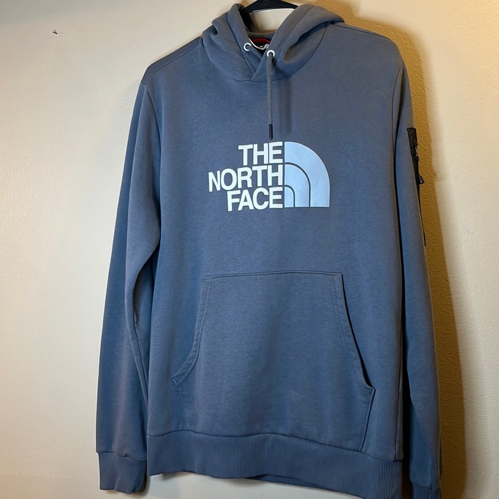 Gray Northface hoodie with pocket on sleeve